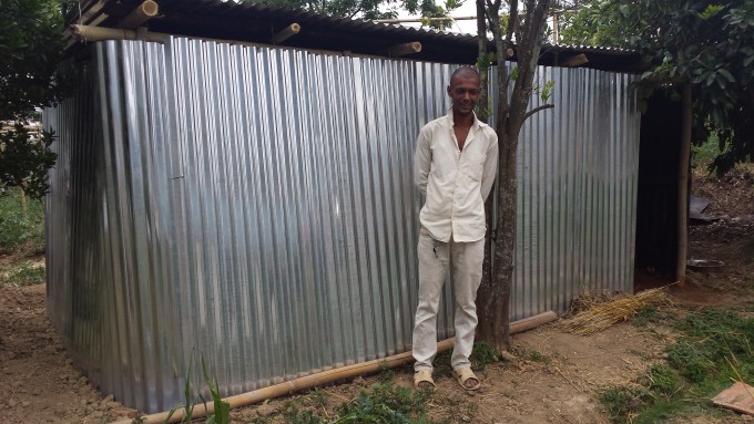 3 father of anjana poudel standing infront of temp shed
