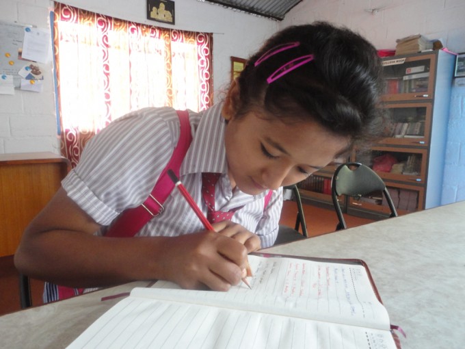 Anita giving contact numbers of teachers of her new school