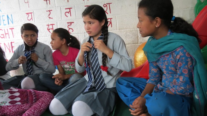 Class of 2012 scholars help new scholars by showing things like how to tie a tie