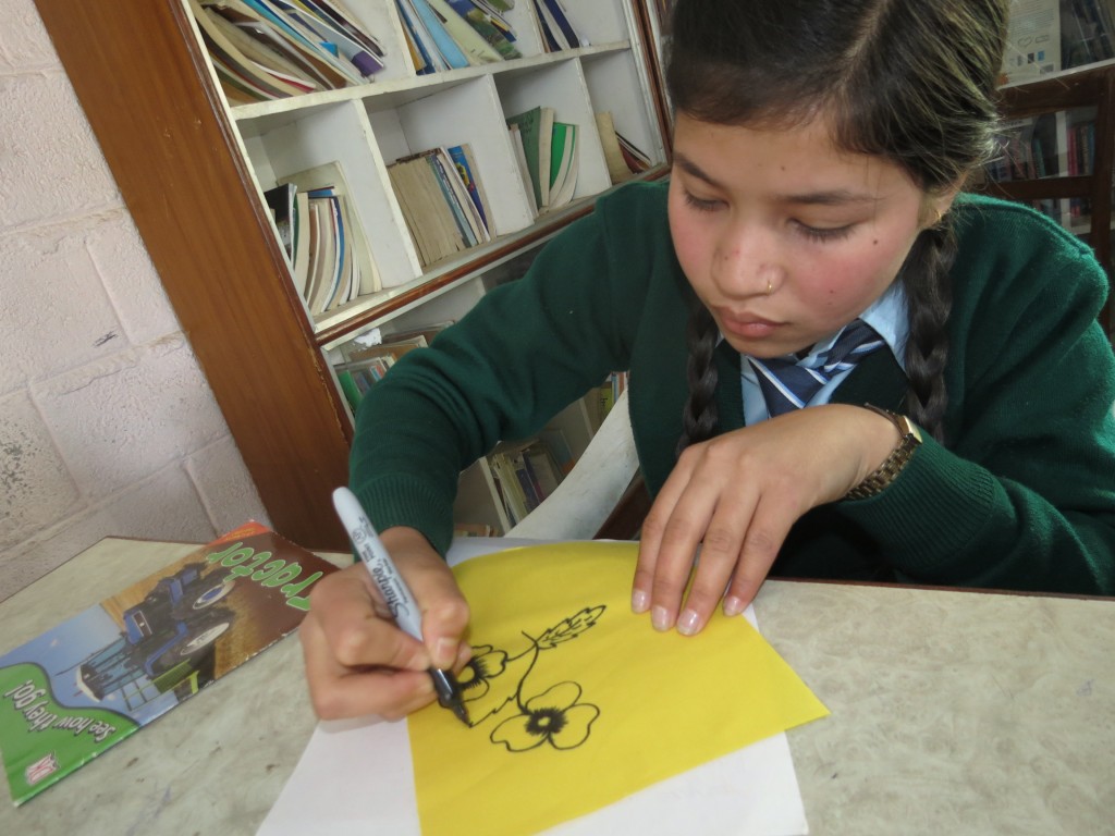 Junu taking part in the flag drawing project
