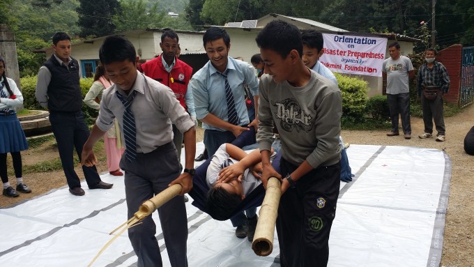 Boys learn to carry an injured person to