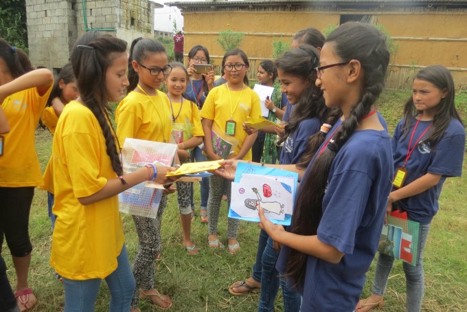 Litclub of Bhaktapur(in blue) sharing gifts with Litclub of Sikharapur(in yellow)