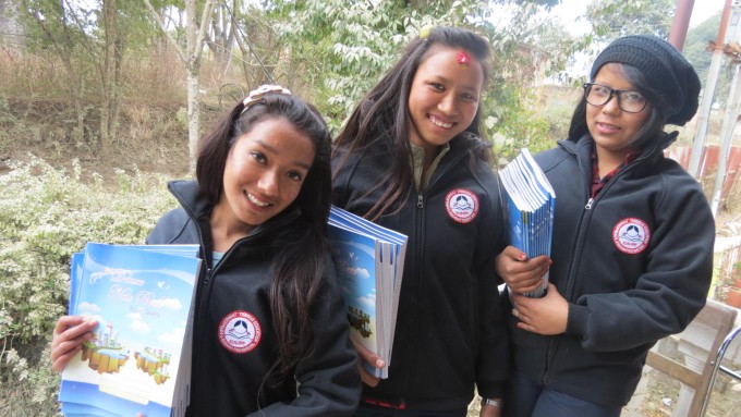 Bimala, Manisha and Junu (left to right) showing their new stationary and jackets