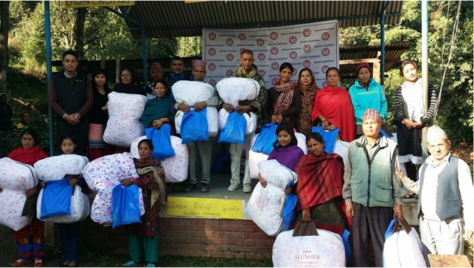 group photo of winter relief distribution