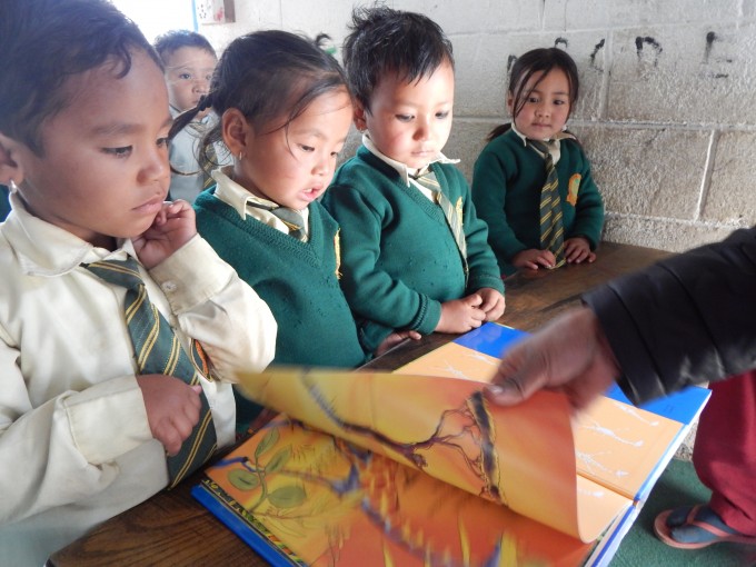 Nursurry Students while reading books