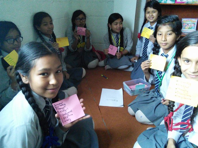 Girls describing their friends with adjectives