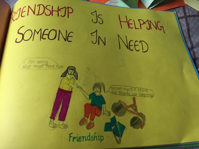 Girls sharing their thoughts on friendship through drawings and quotes
