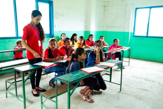 Girls come up with question for conducting interview