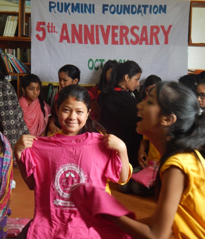 scholar-divya-kc-checks-her-tshirt-size-with-great-smile-in-her-face