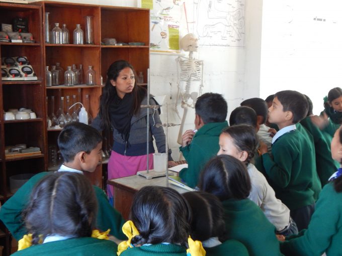 students-observing-science-lab