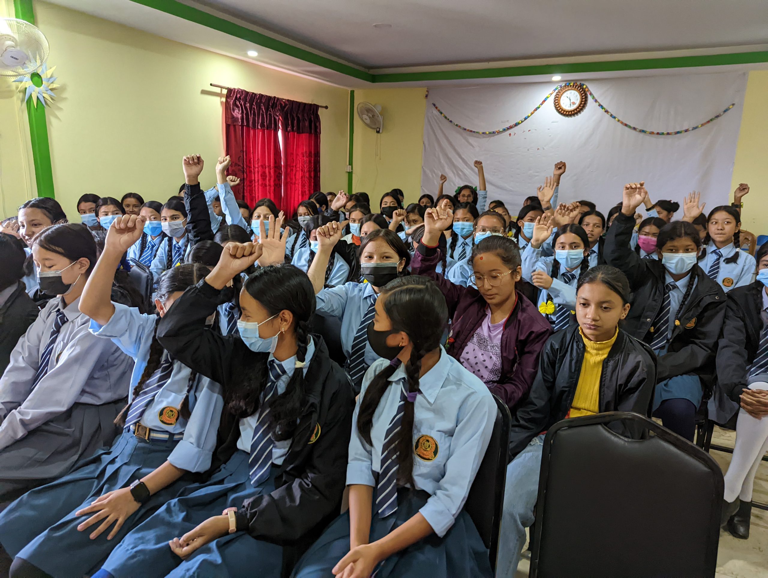 Girls raising hand who still