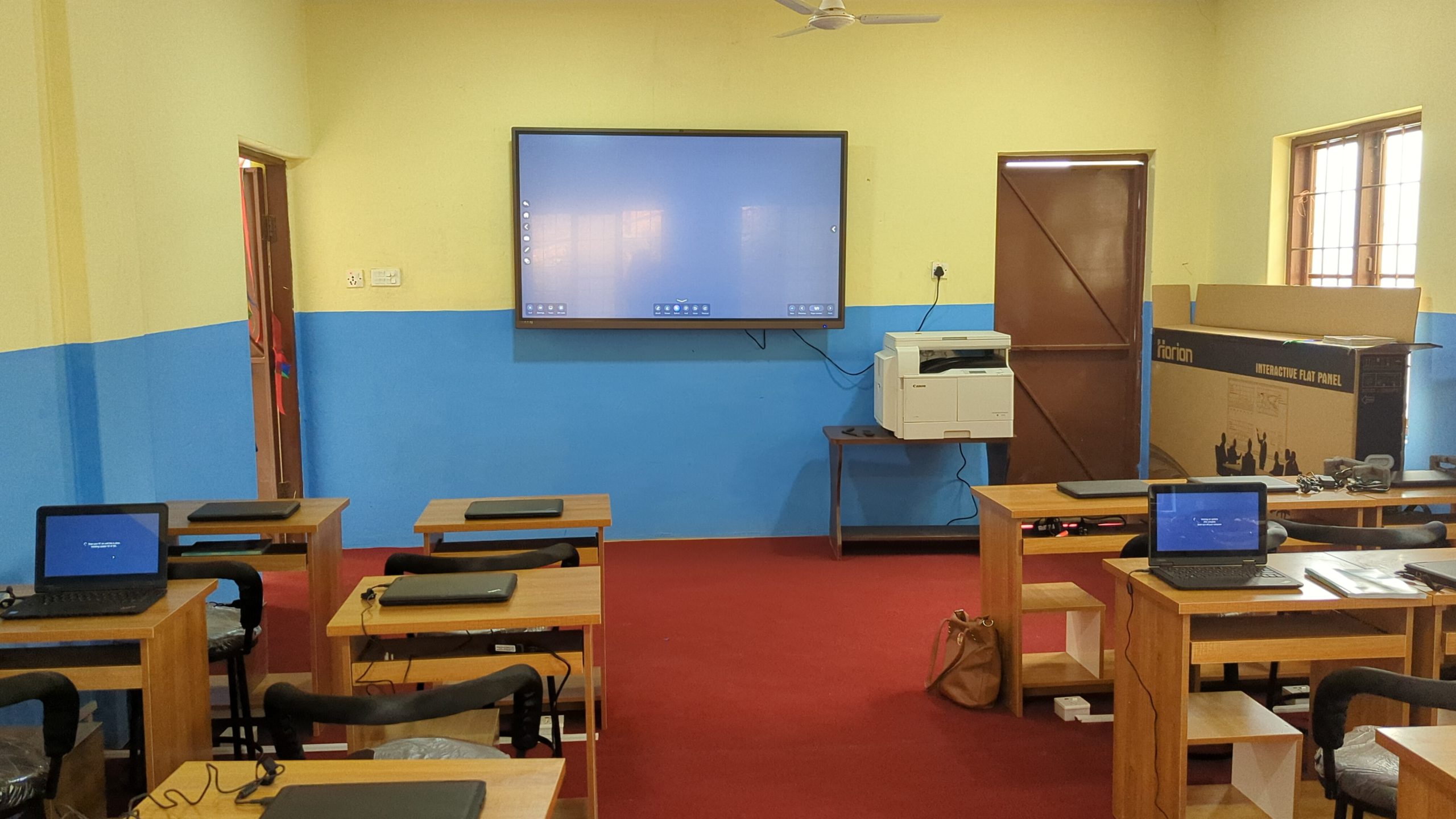 ICT lab with smart board, printer and 25 laptops