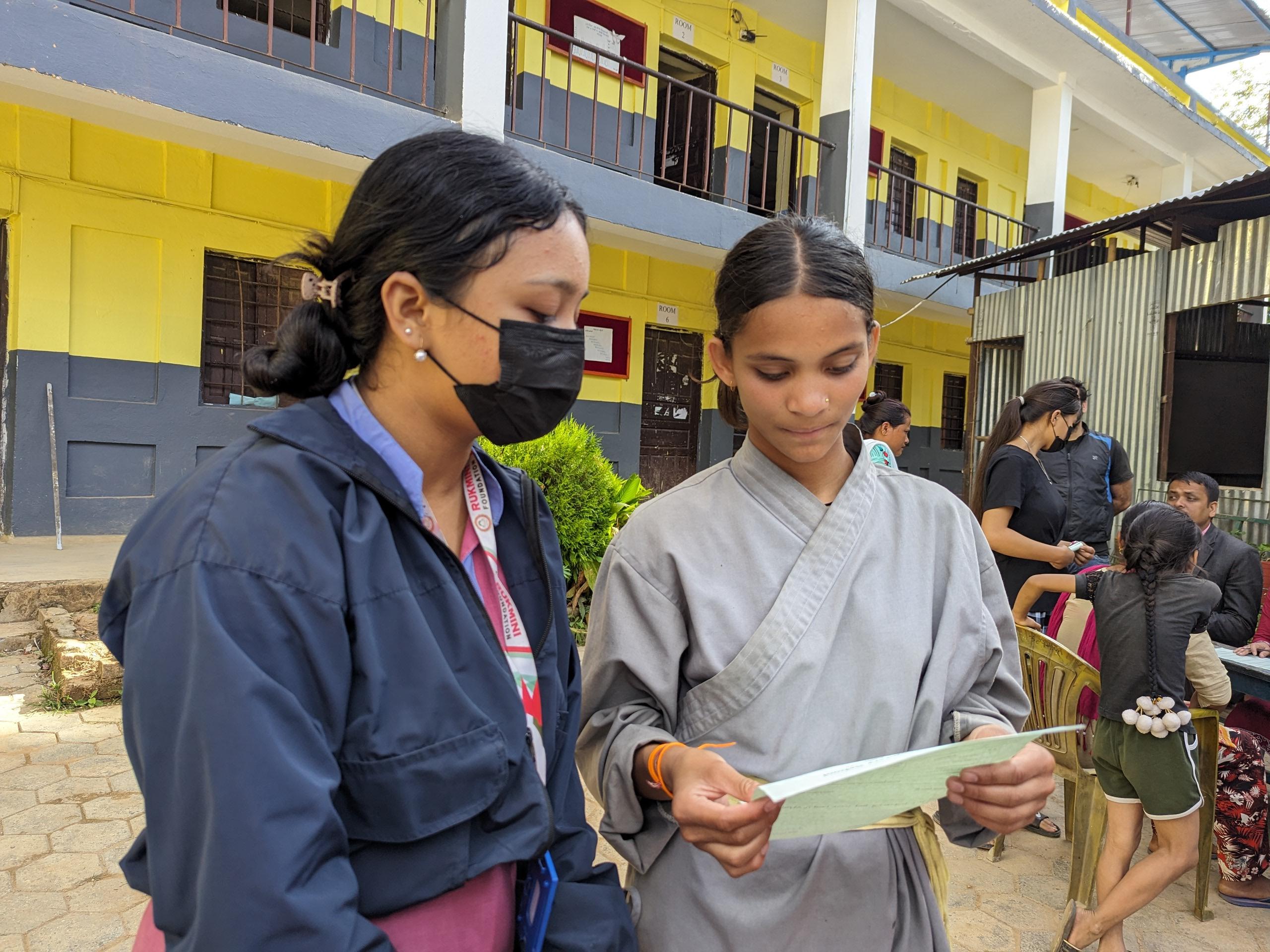 RF Bahini Sunita B.k showing her result to RF didi Tamanna Rai_