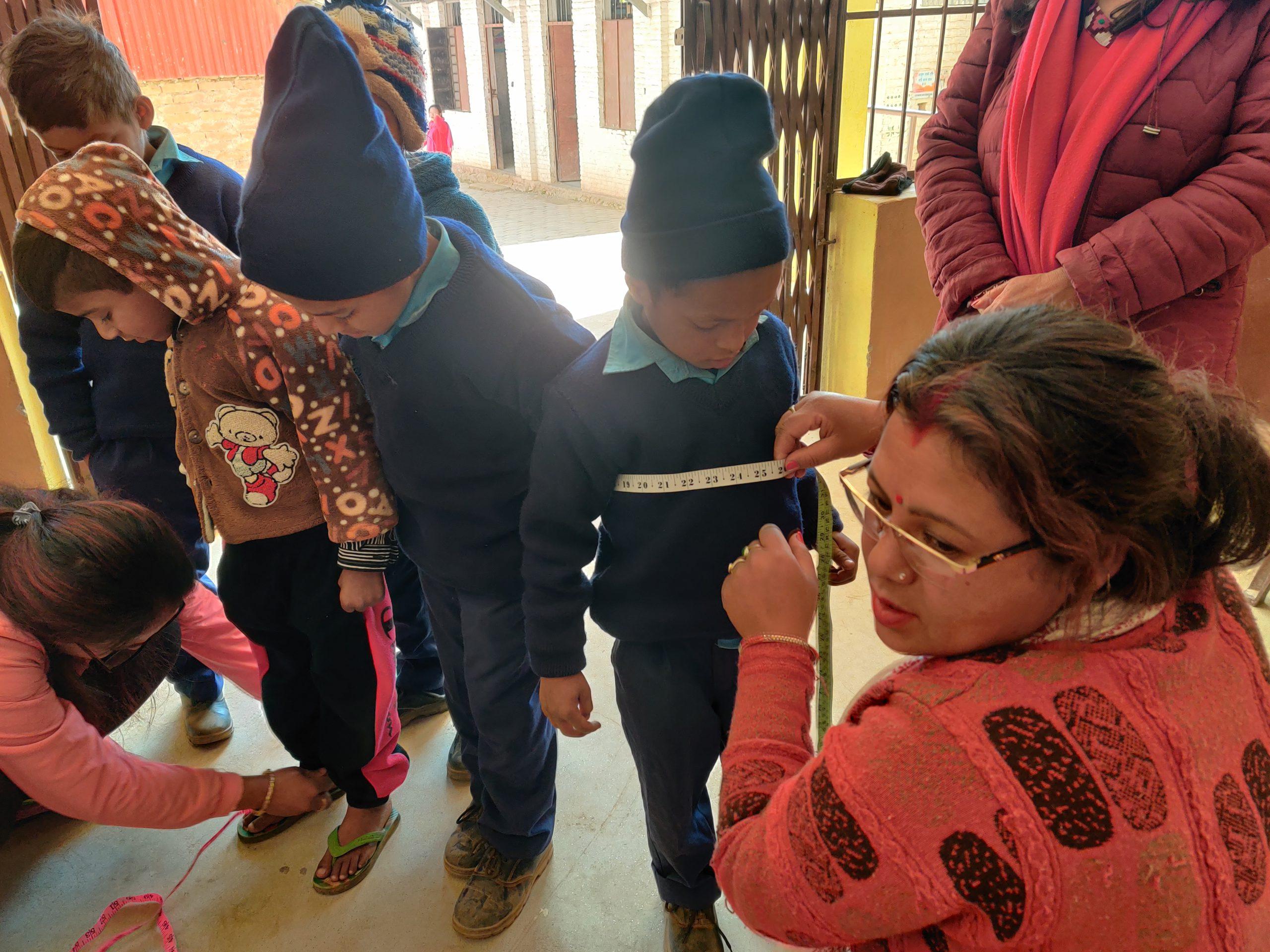 Karuna Sunar measuring for uniform