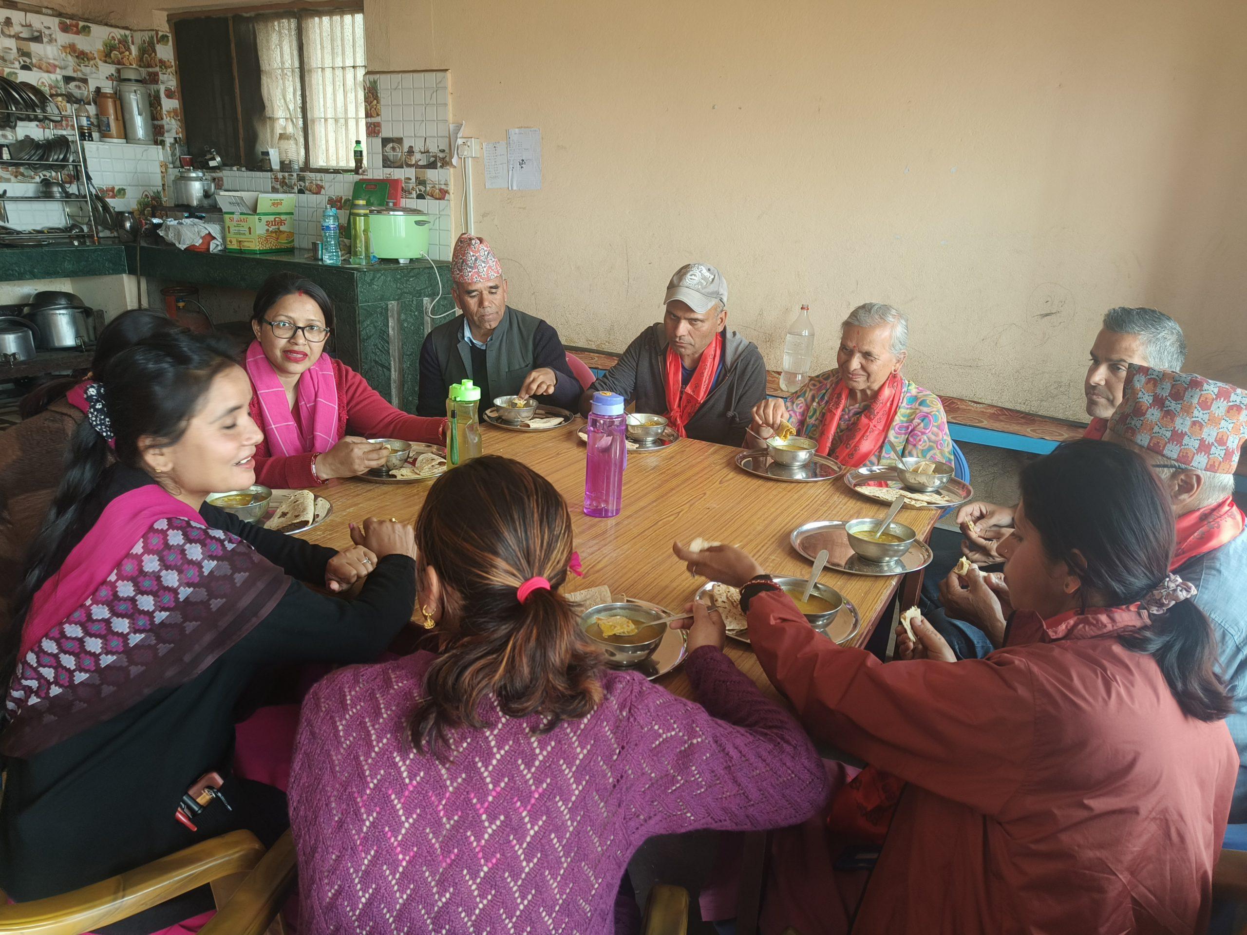 Rukmini team observing and eating meal at Setidevi Secondary School