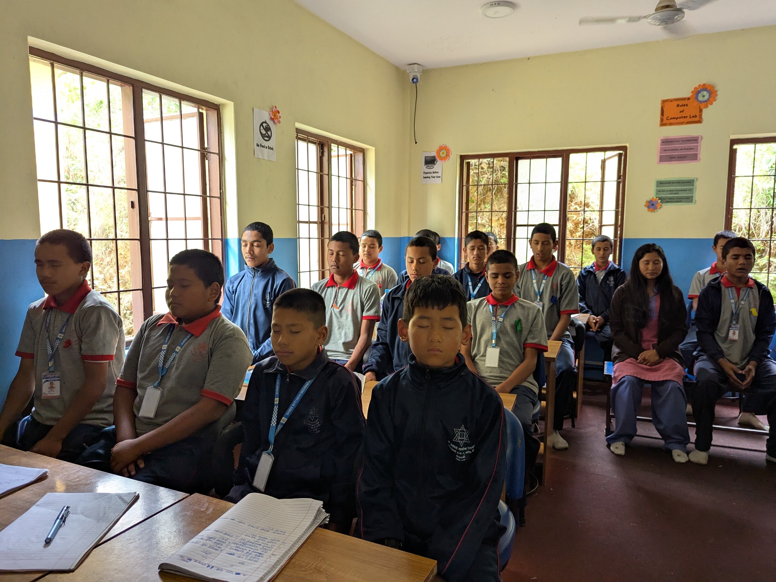 Students practicing deep breathing techniques_