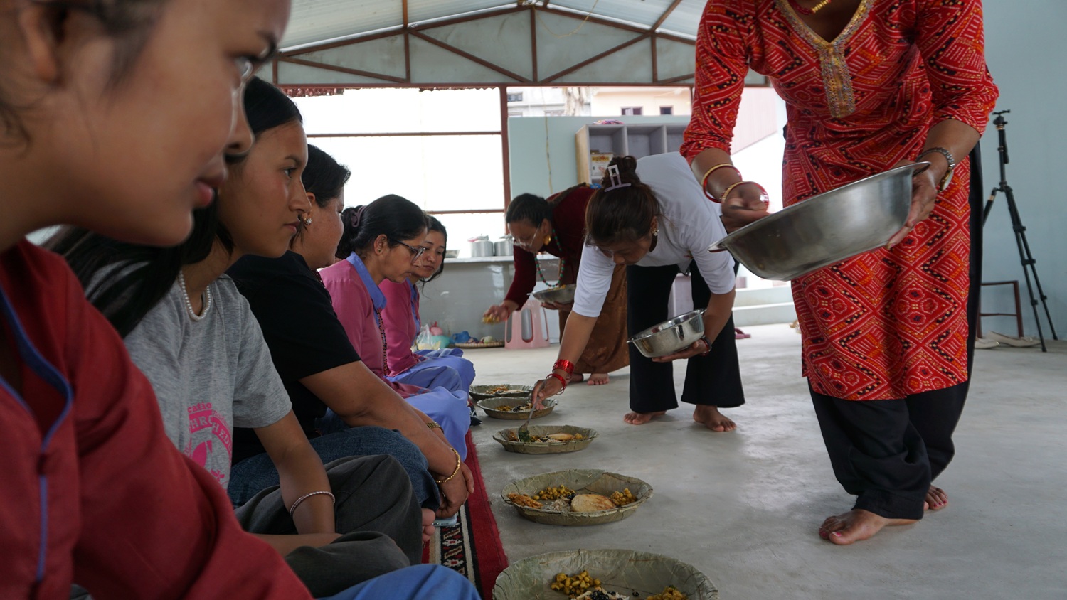 The sisters are distributing Newari khaja sets to everyone_